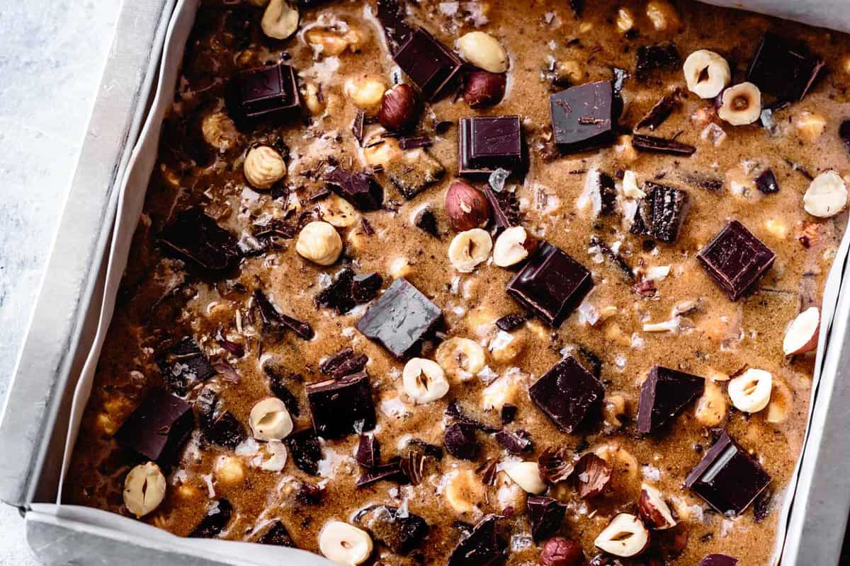 gluten-free blondie batter in the pan, pre-baking