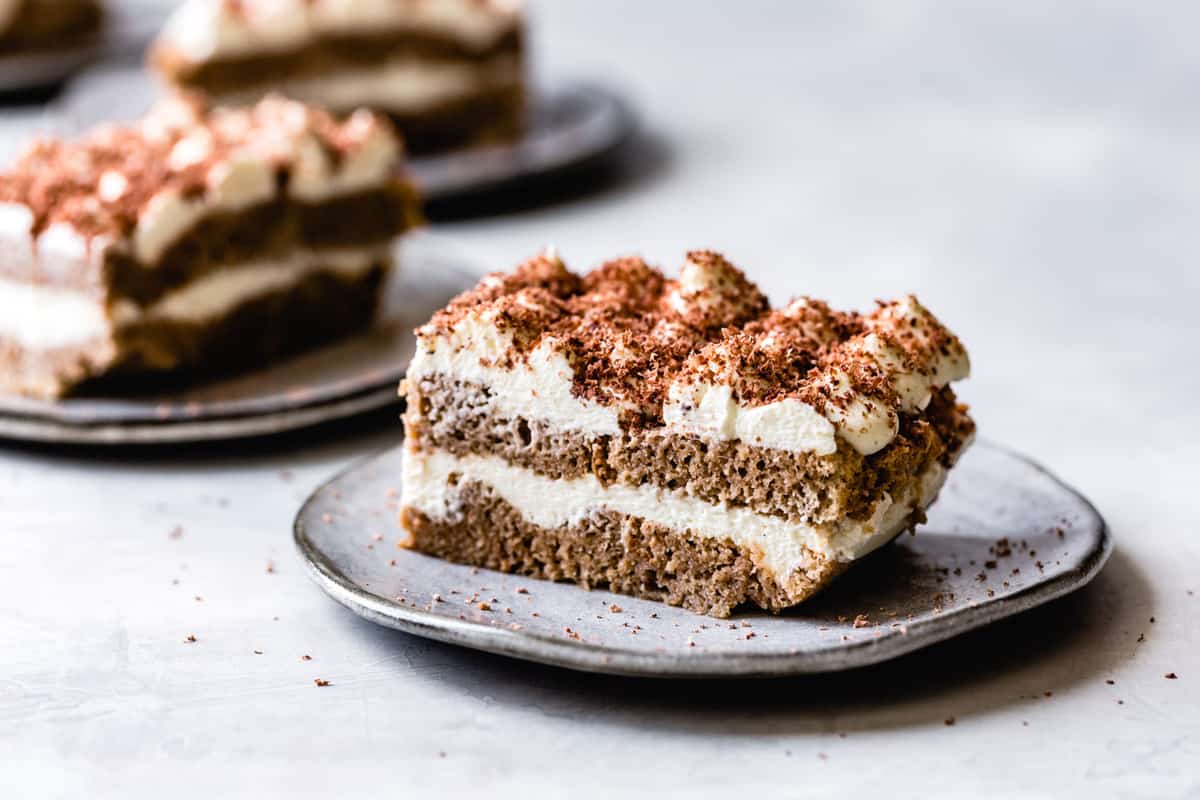 3 slices of tiramisu dessert on plates