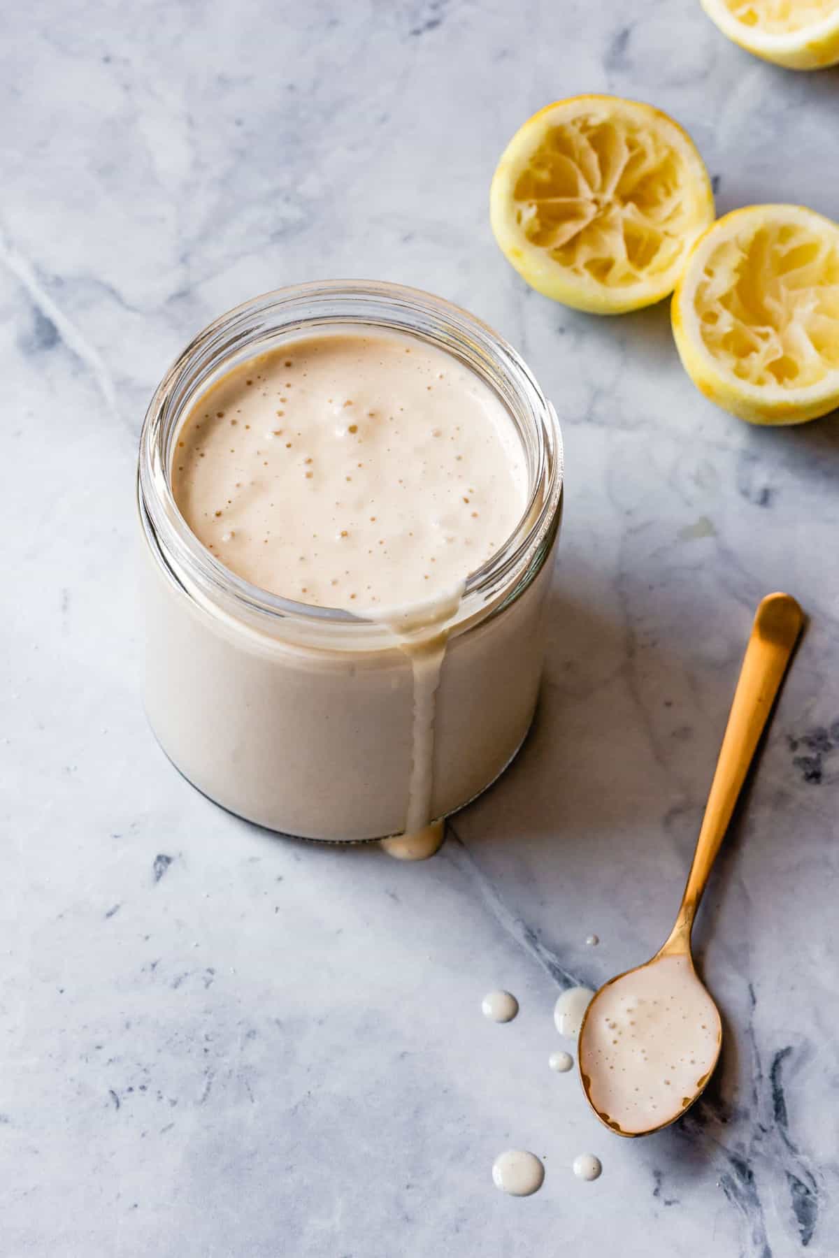 freshly made cashew frosting in a jar