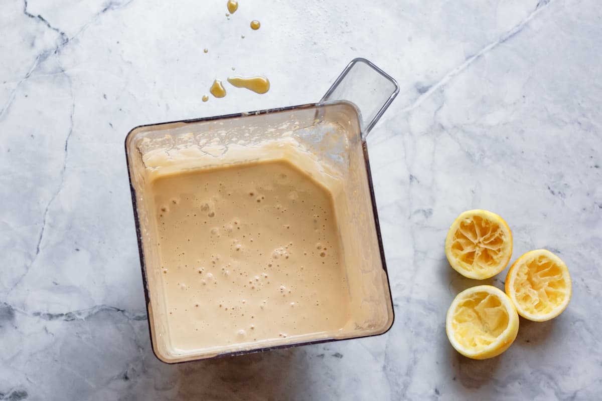 making cashew cream cheese frosting in a blender