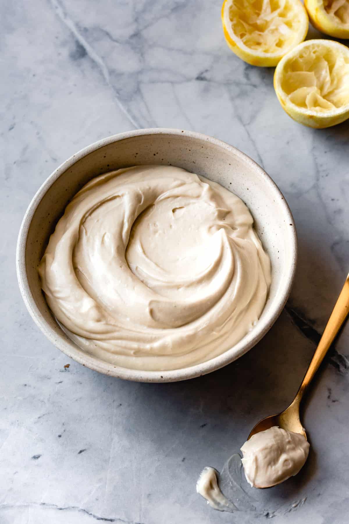 a bowl of frosting has a luscious swirl in it