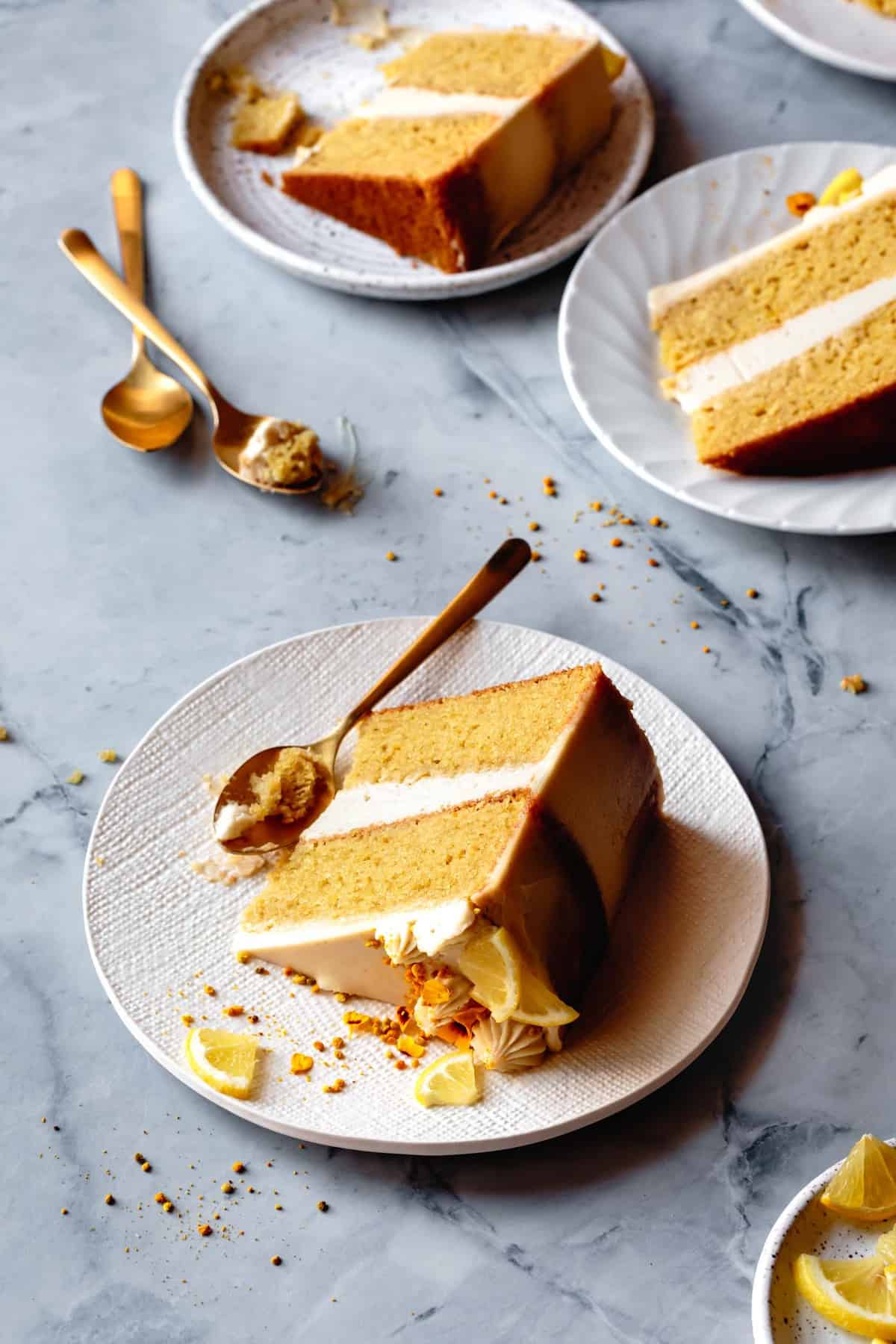 slices of coconut flour cake on plates with spoons and crumbs