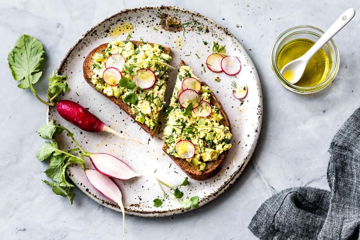 egg salad tartine on a fabulous speckled ceramic plate