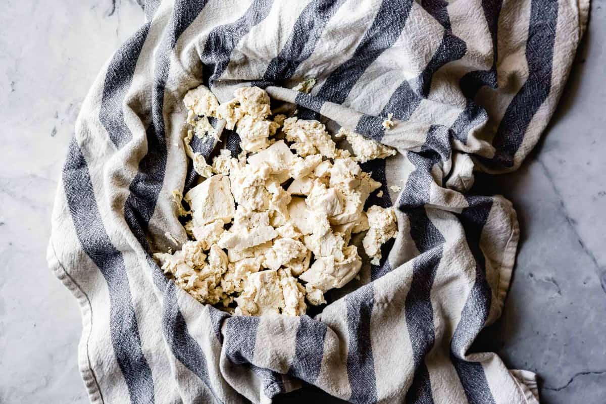 squeezing moisture out of tofu for curried tofu salad