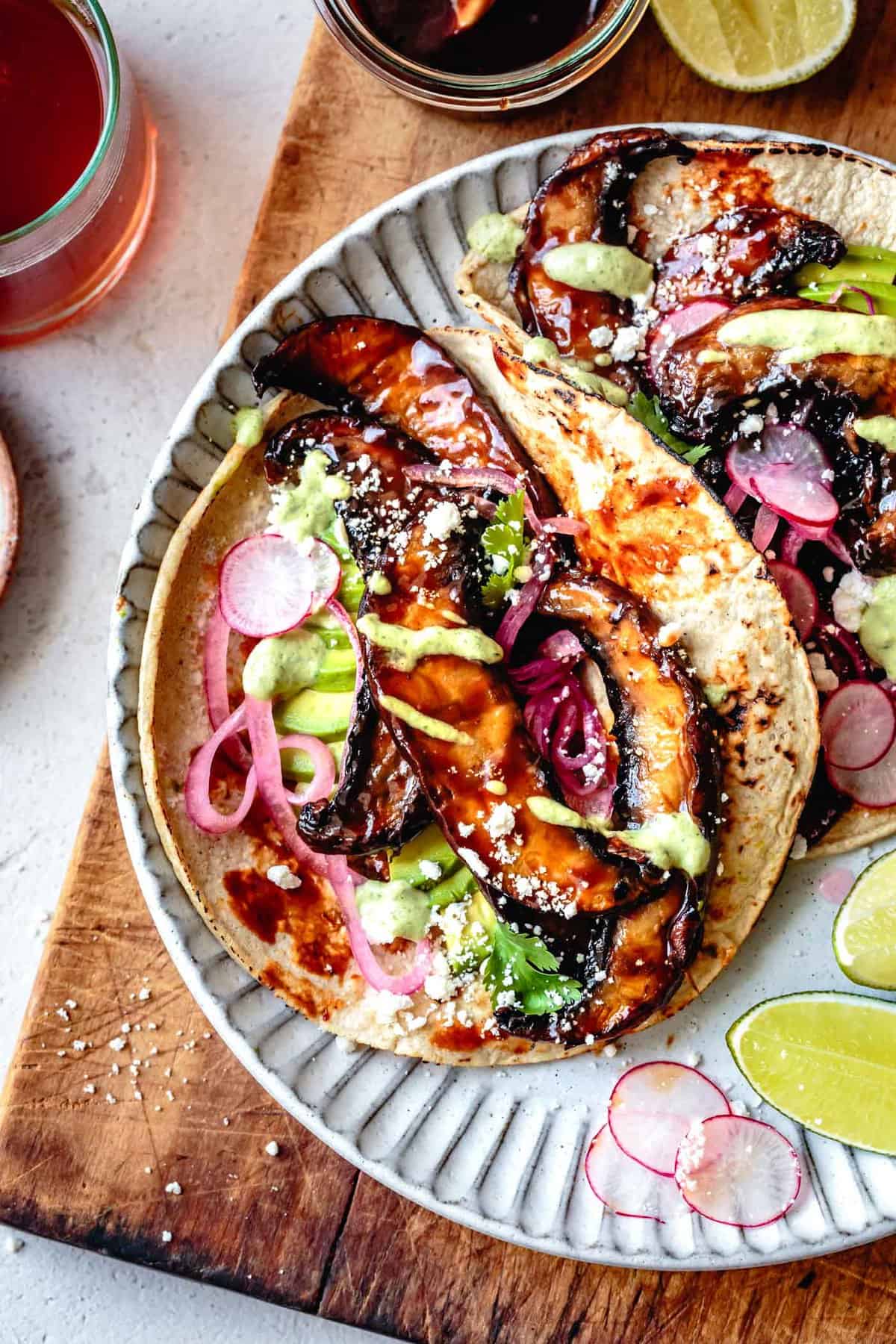 mushroom tacos on a plate on a wooden board 