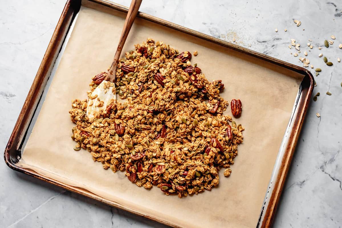 unbaked granola on a sheet pan