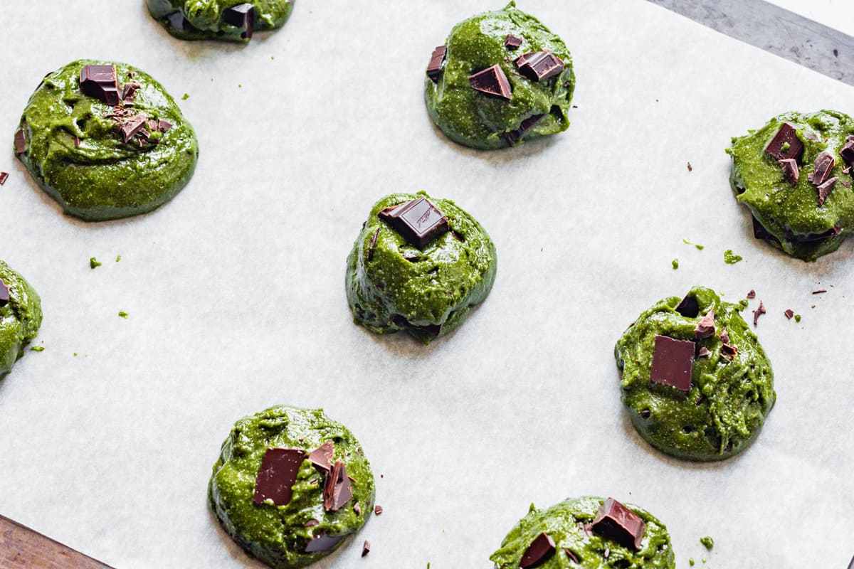unbaked healthy matcha cookies on a baking sheet