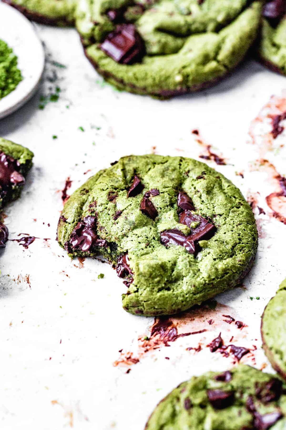 close up of a vegan matcha cookie with a bite taken out