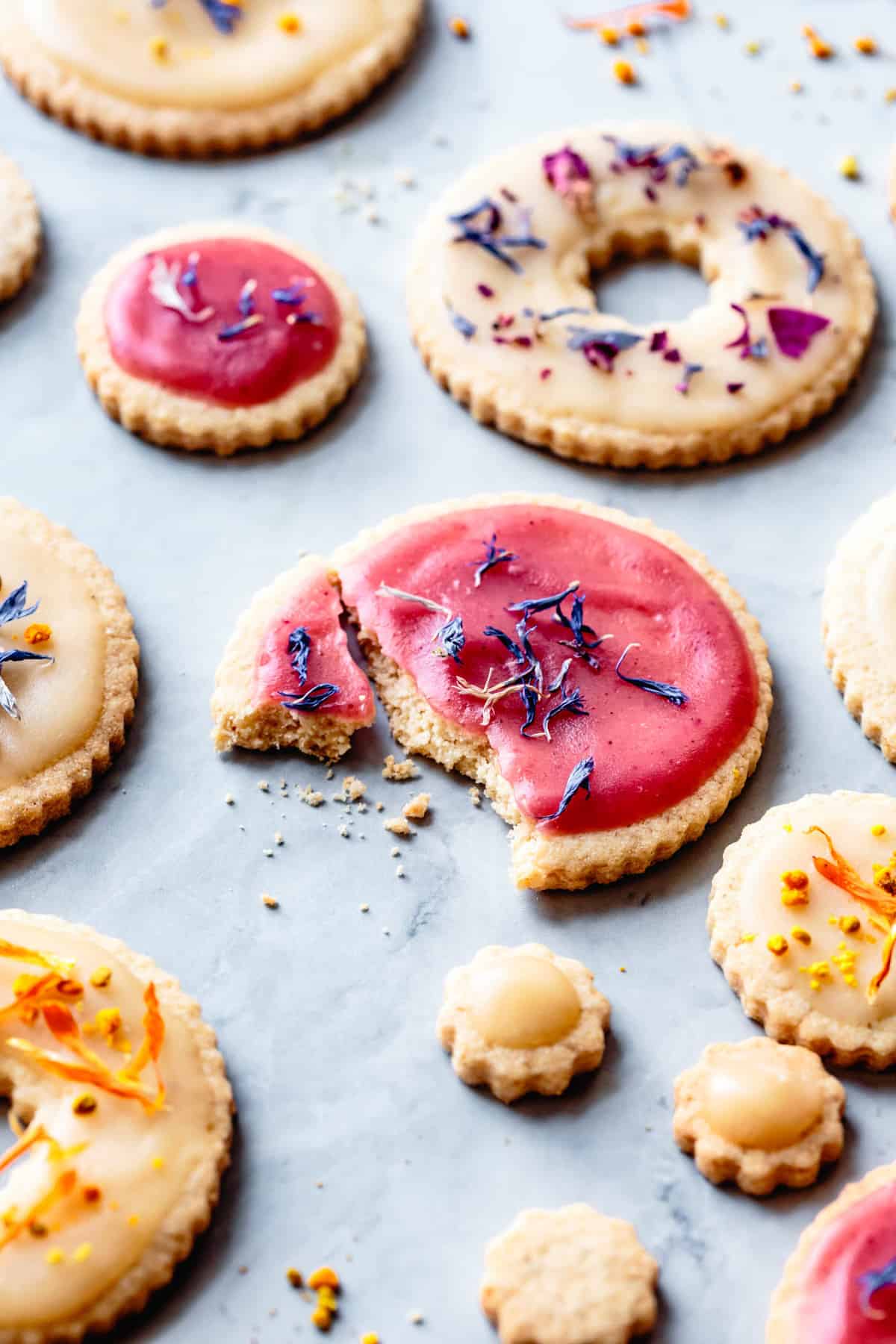 Sugar cookies topped with coconut butter glaze and dried flower petals