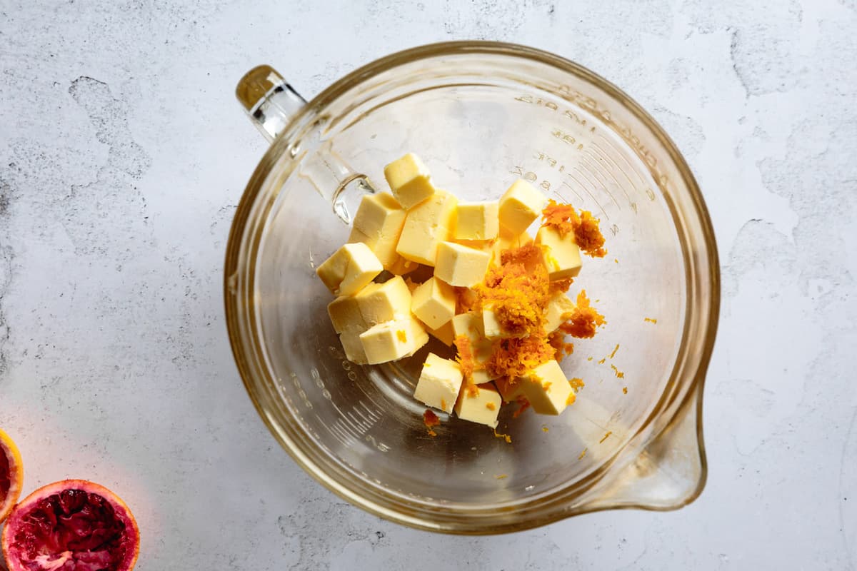 butter and orange zest in a pitcher
