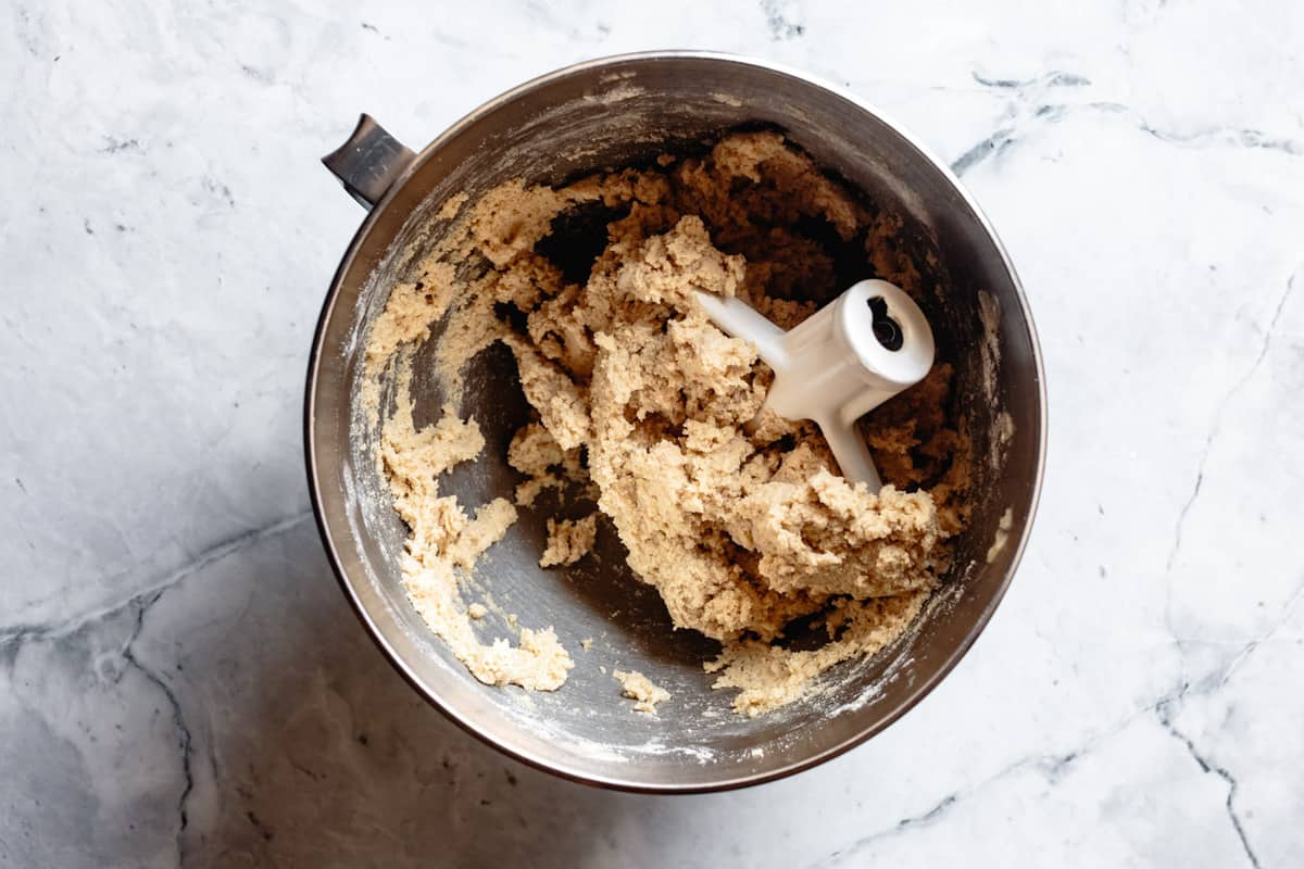 mixed gluten-free sugar cookie dough in a stand mixer