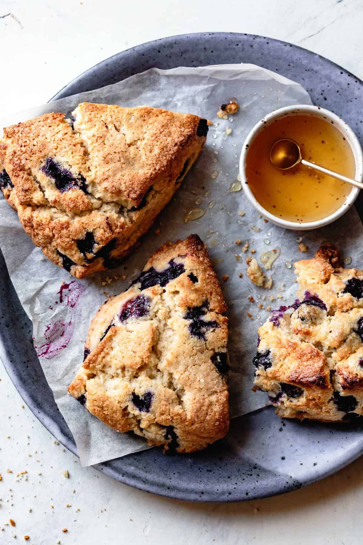 three blueberry scones on a plate