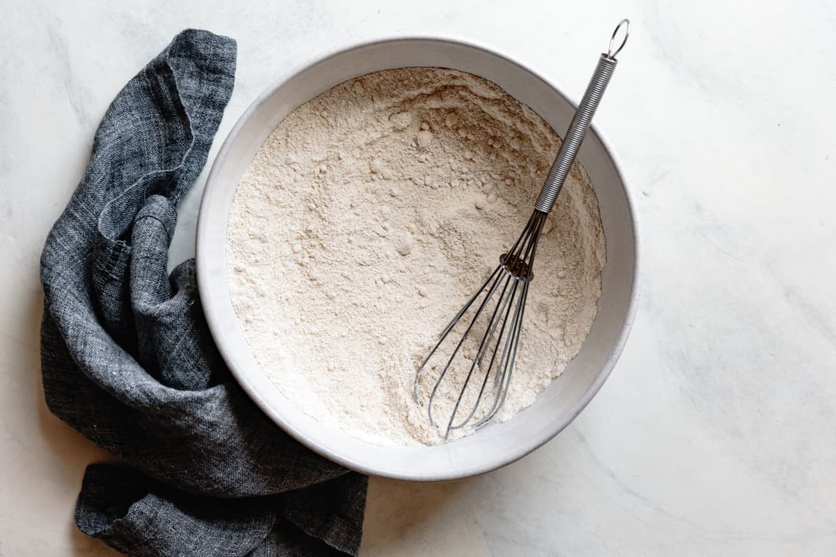 whisked flours in a light gray bowl