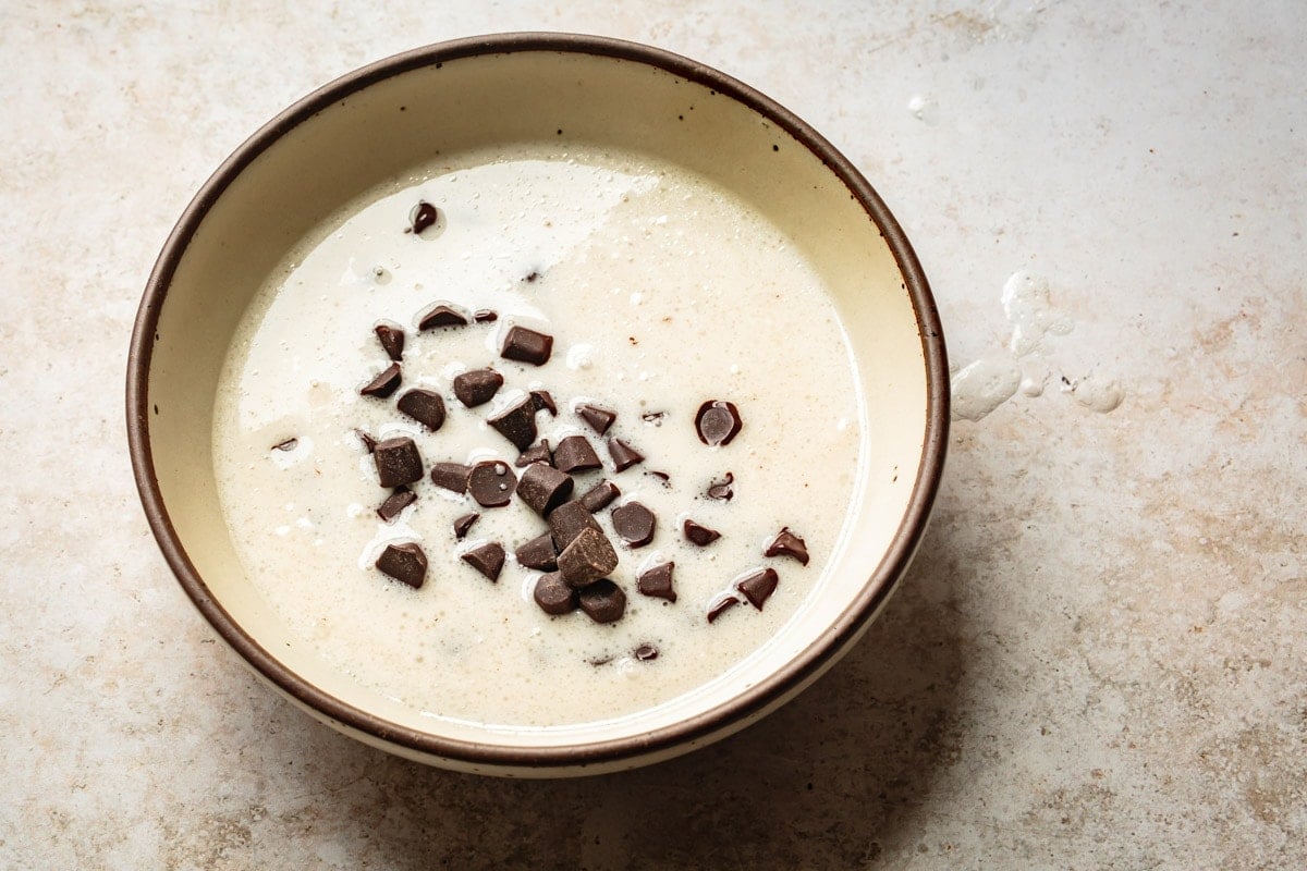 warm coconut milk has been added to the chocolate chunks
