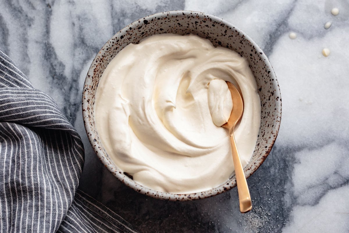 the finished mascarpone cream, swirled in a speckled bowl