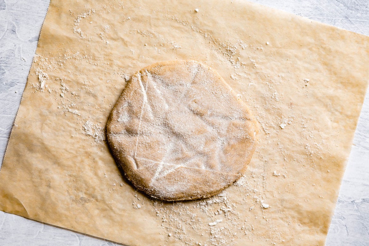 the chilled dough has been dusted with flour in preparation for being rolled out