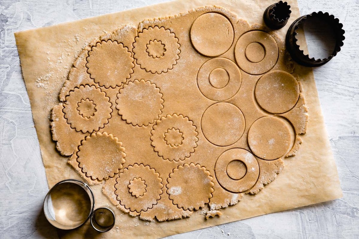 cookies have been cut out using both round and fluted cutters