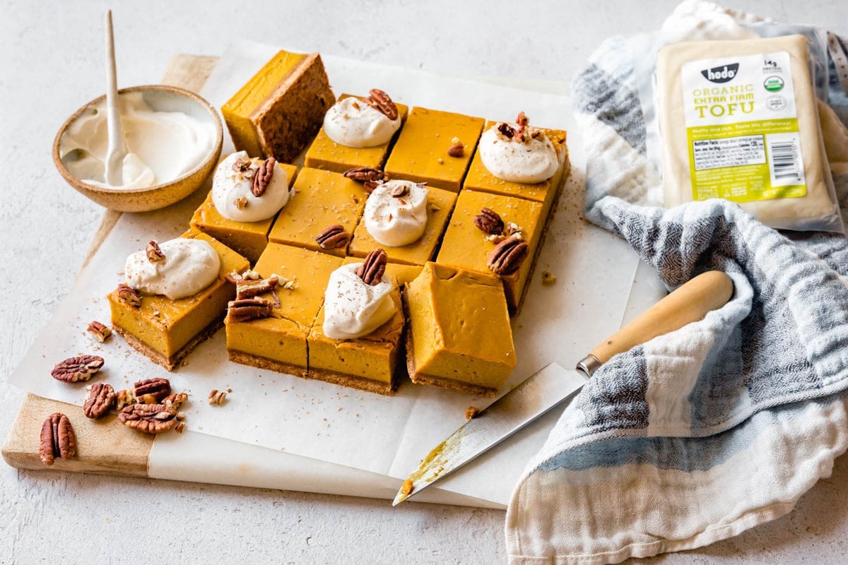 a collection of pumpkin bars shown with the secret ingredient: extra-firm tofu!