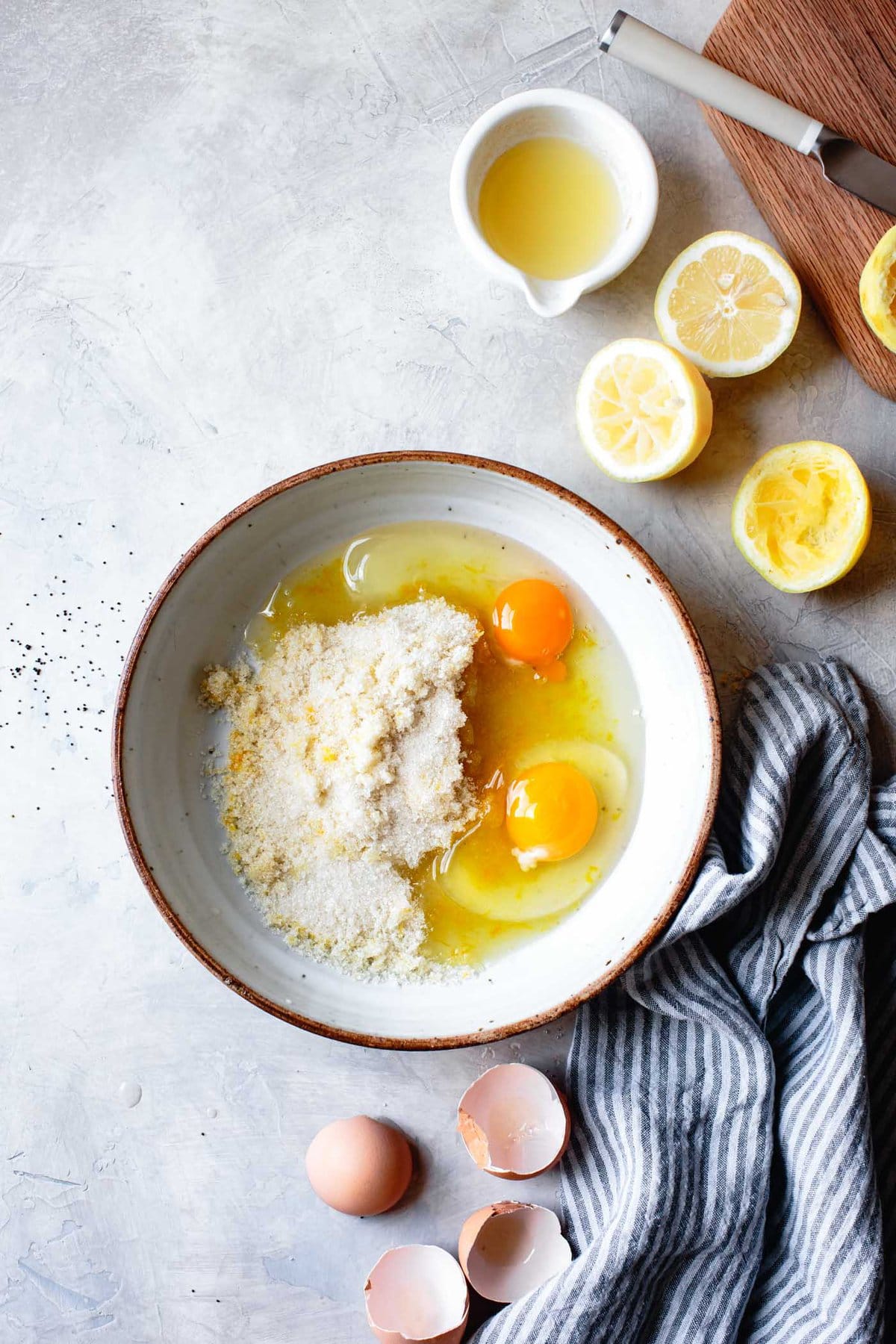 The eggs and lemon sugar are side by side in a bowl