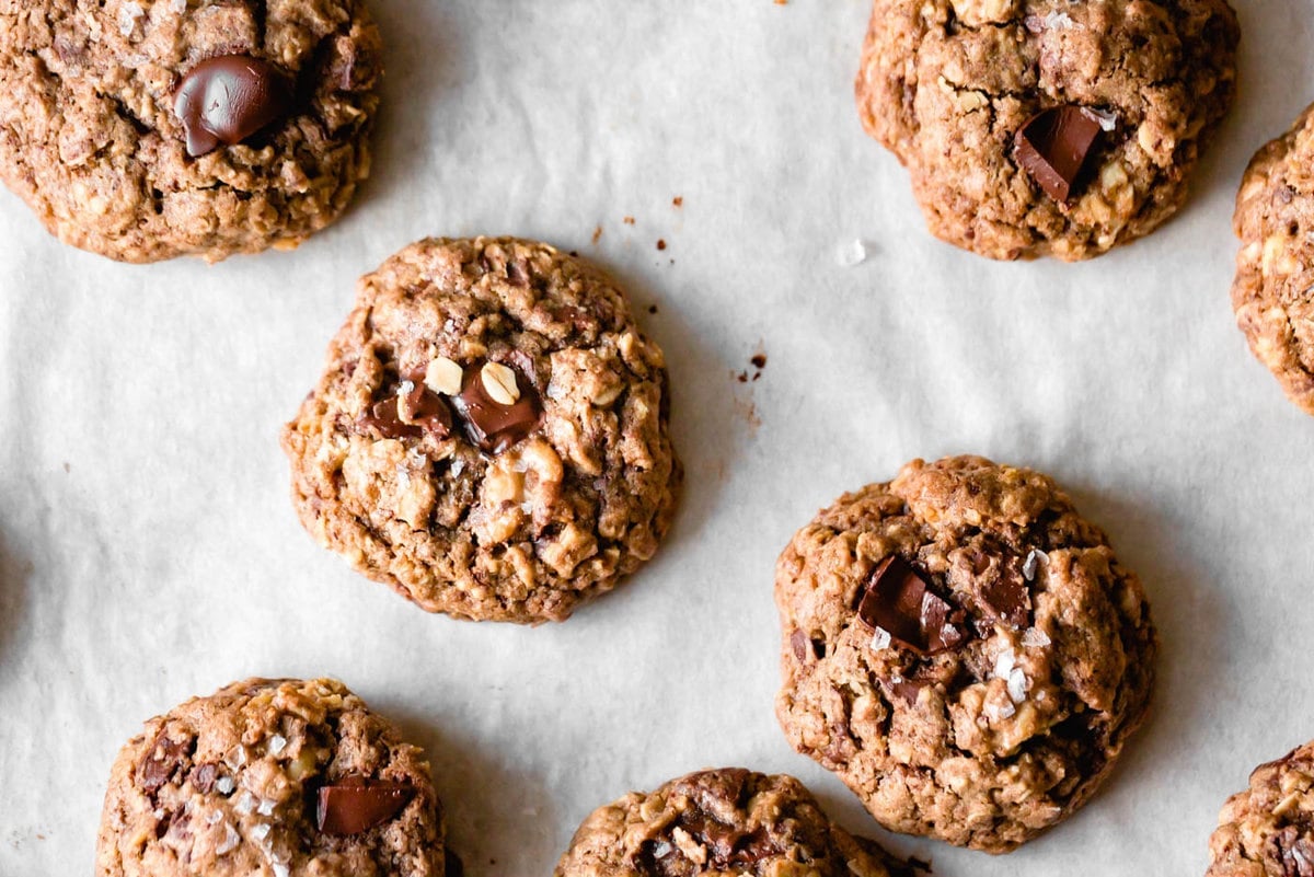 cookies are on a piece of parchment paper looking luscious and chonky