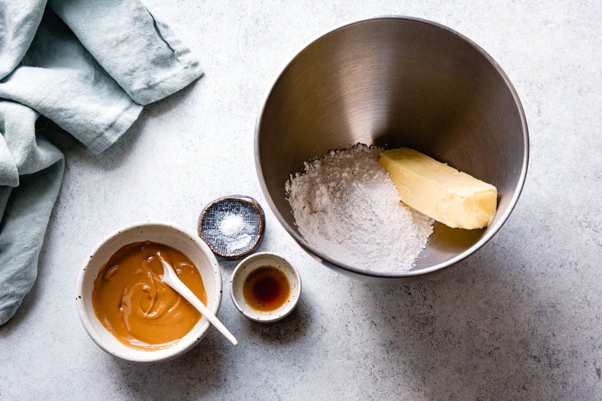 the butter and powdered sugar have been added to a metal mixing bowl