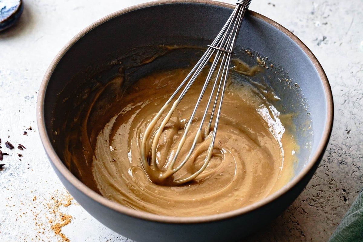 the wet ingredients are being whisked together