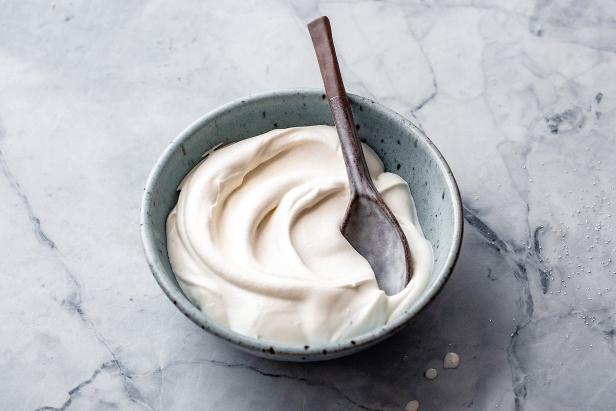 swirls of creme fraiche are in a bowl ready to use