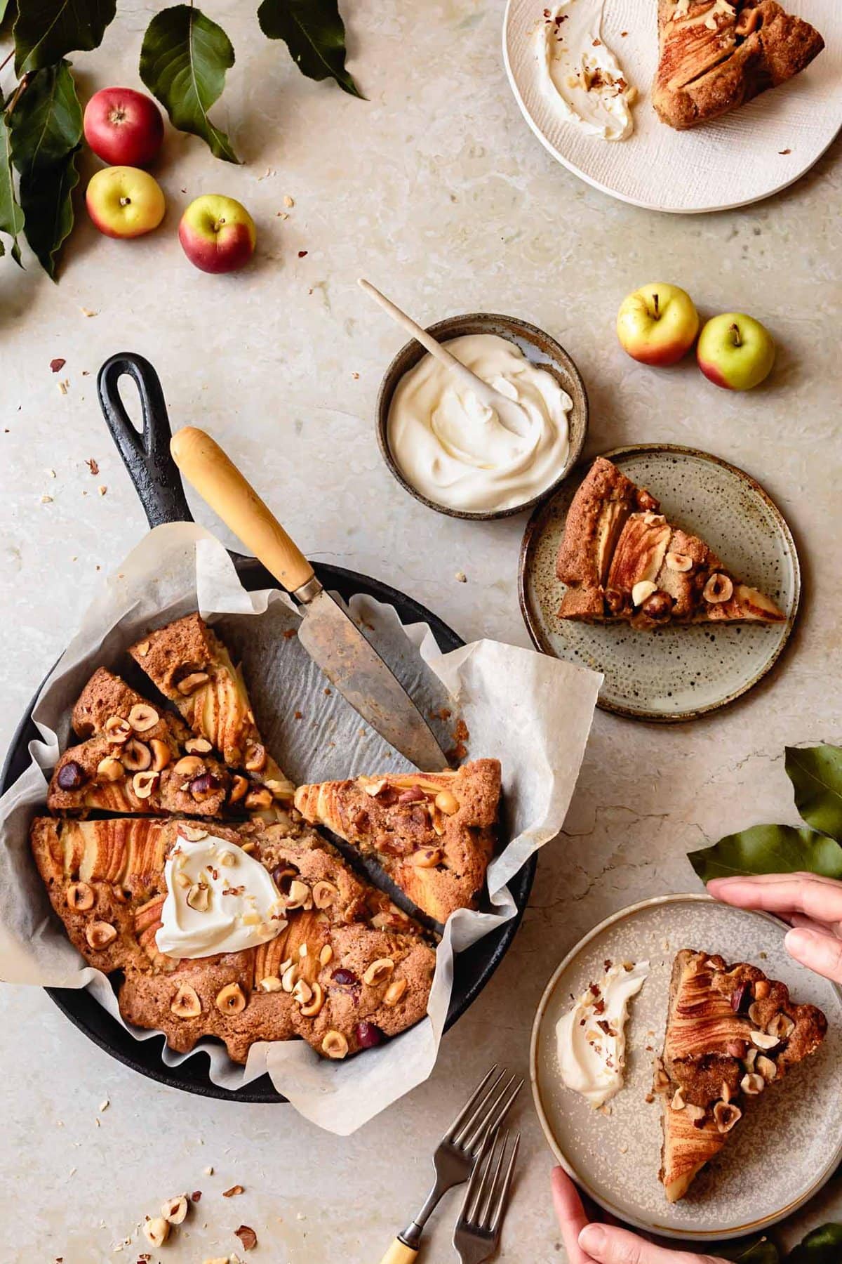an apple cake is being served up with swirls of creamy goodness