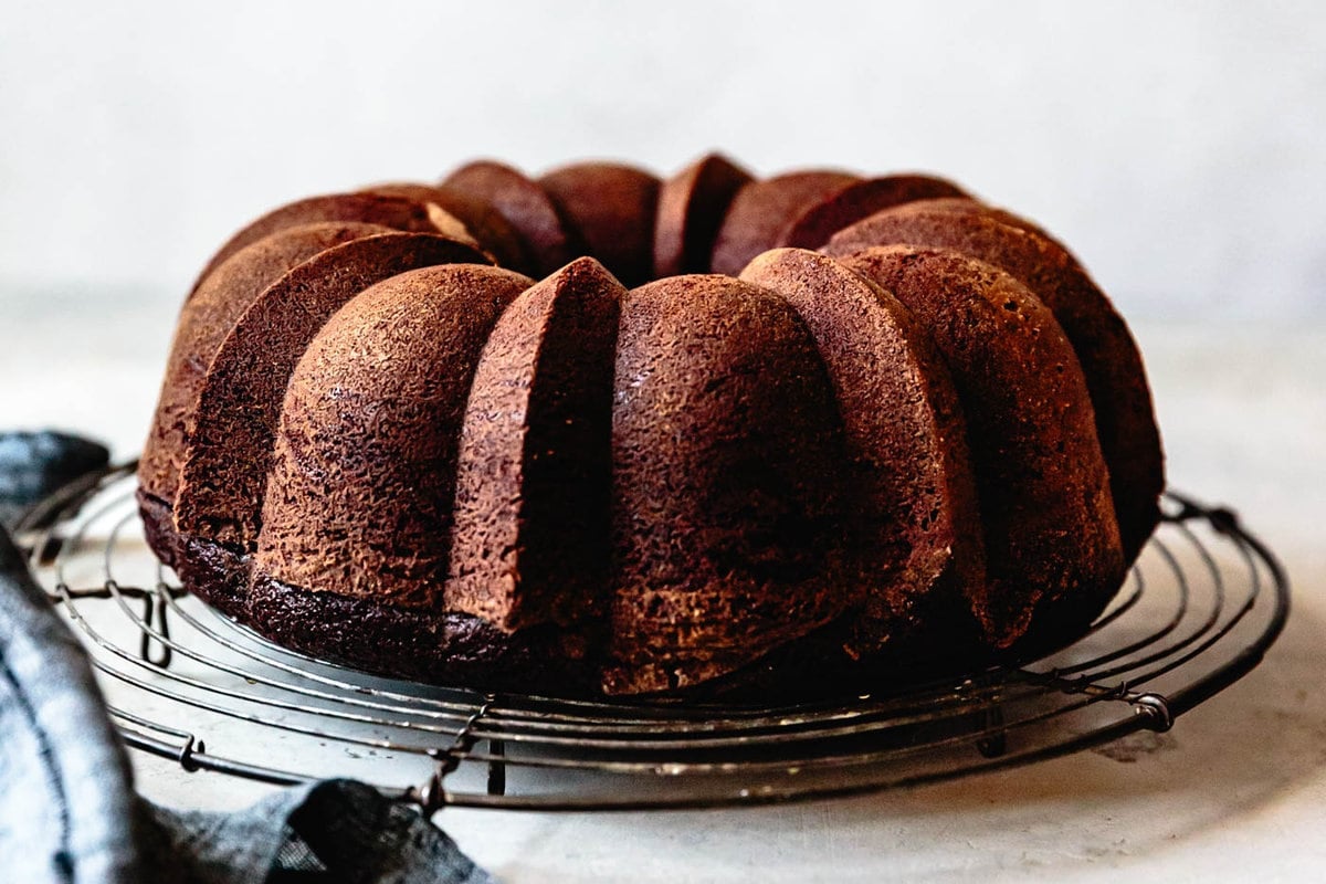 A perfectly smooth bundt cake, fresh from the oven on a wire rack