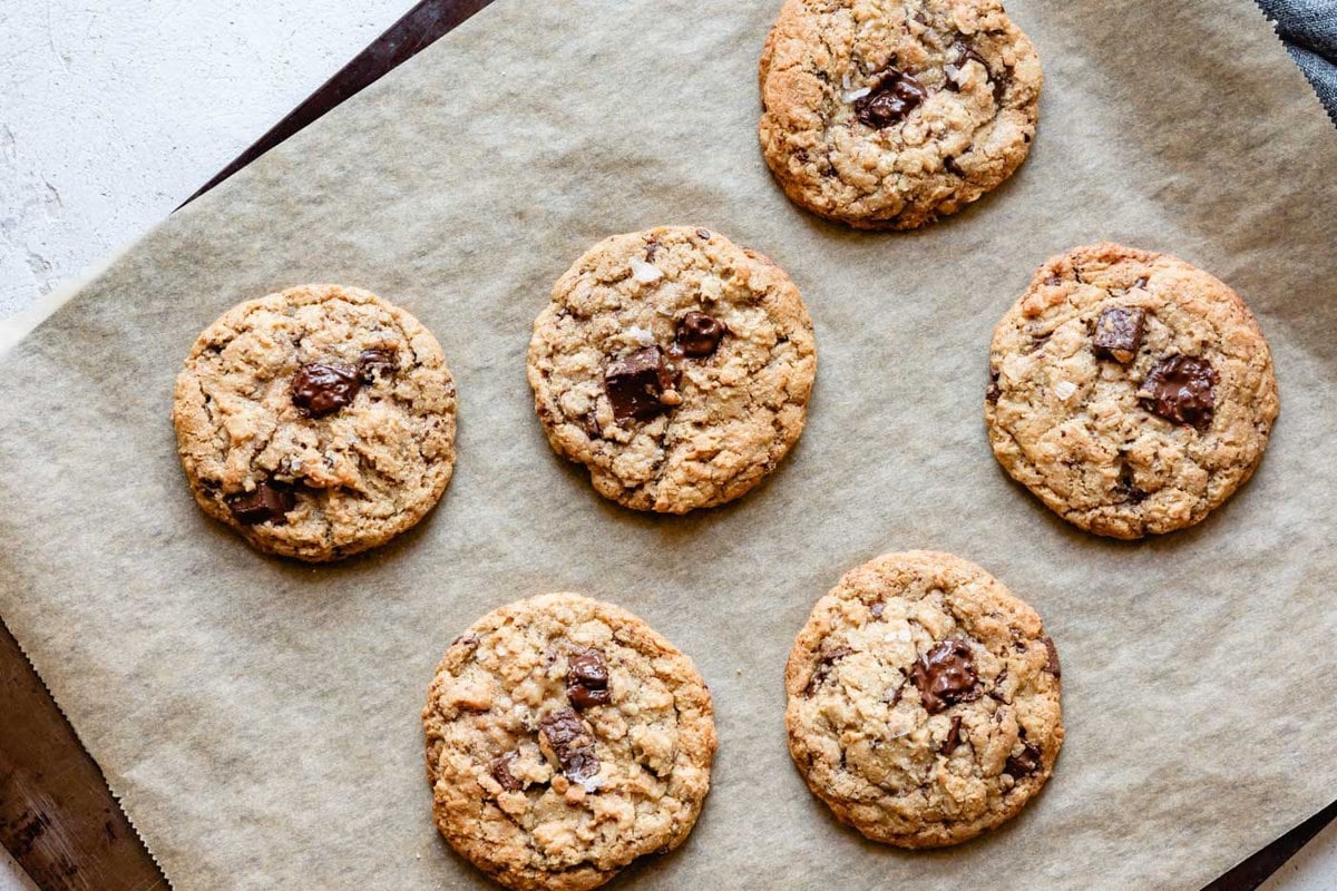freshly baked cookies are on a sheet pan