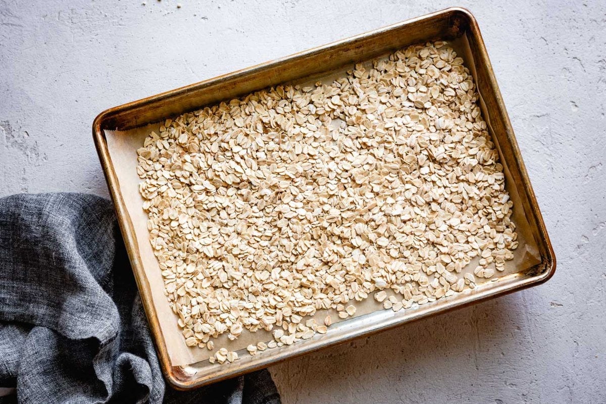 oats are on a baking sheet ready to toast