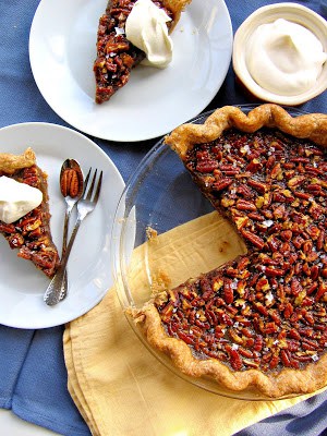 top down shot of pecan pie and slices on plates 