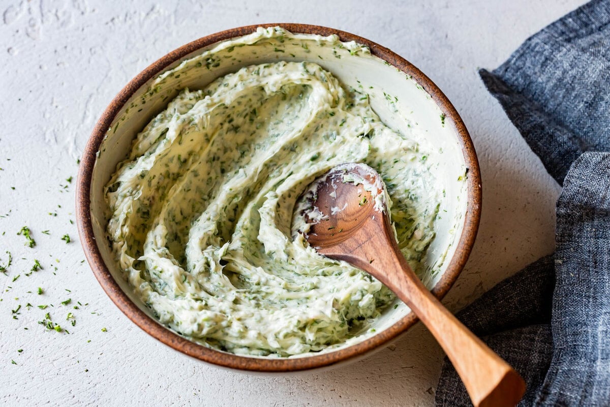 the finished herb butter has been mixed in a bowl