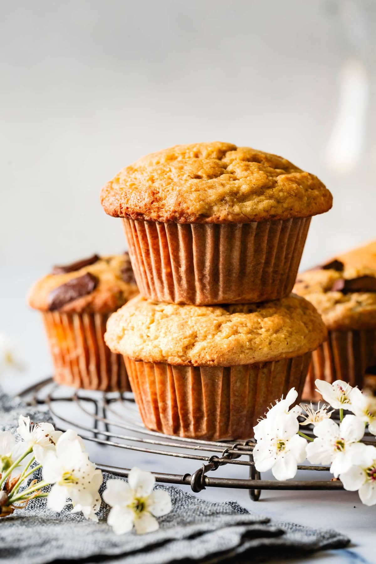 a pair of muffins, stacked heroically