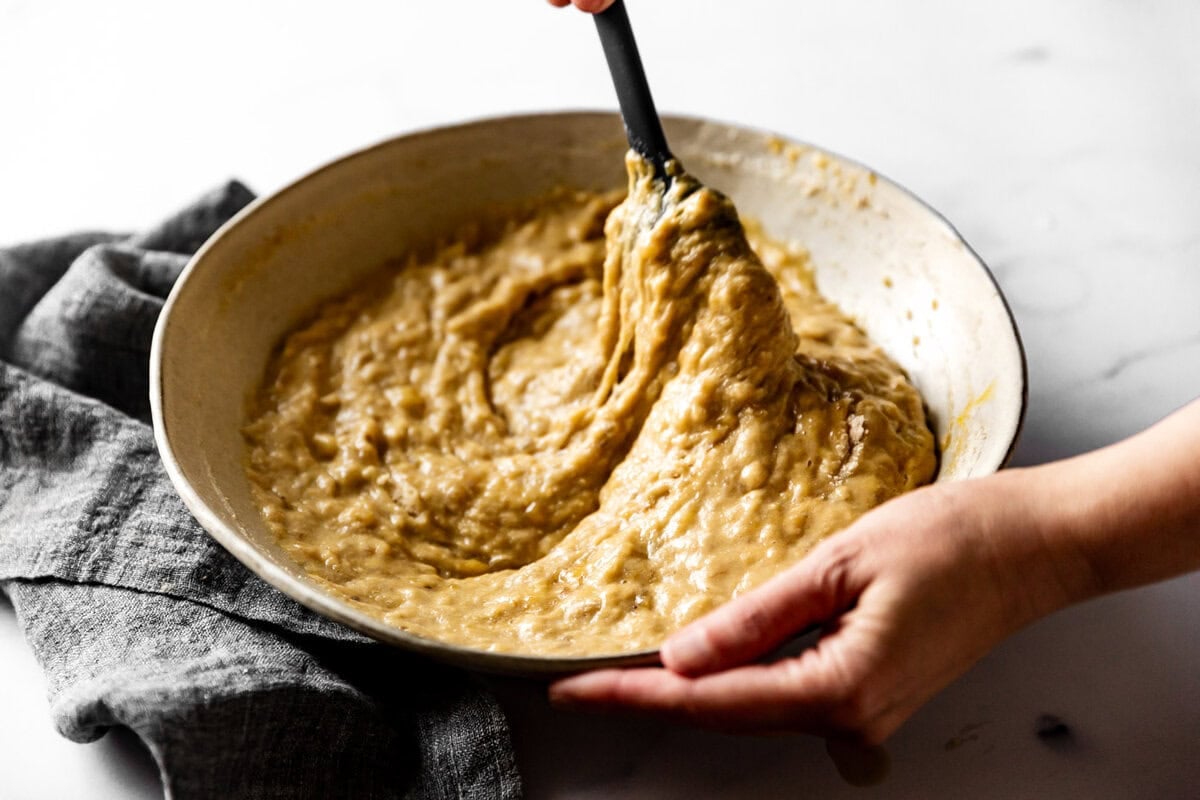 stirring the thick batter