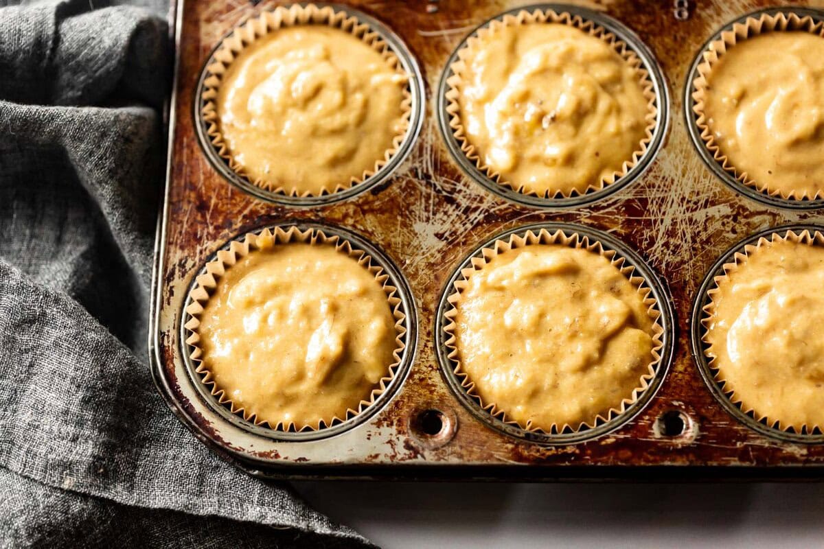 the filled muffin cups are ready to bake
