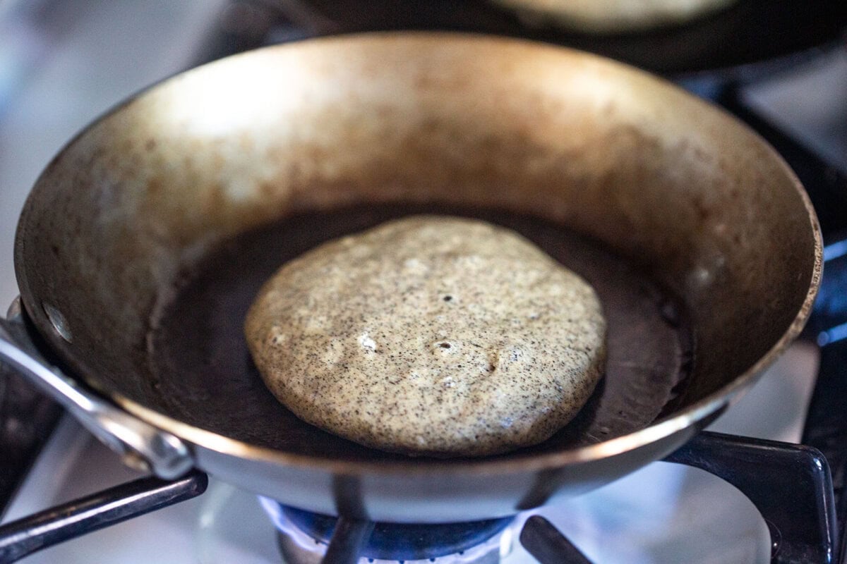 cooking a pancake in a pan