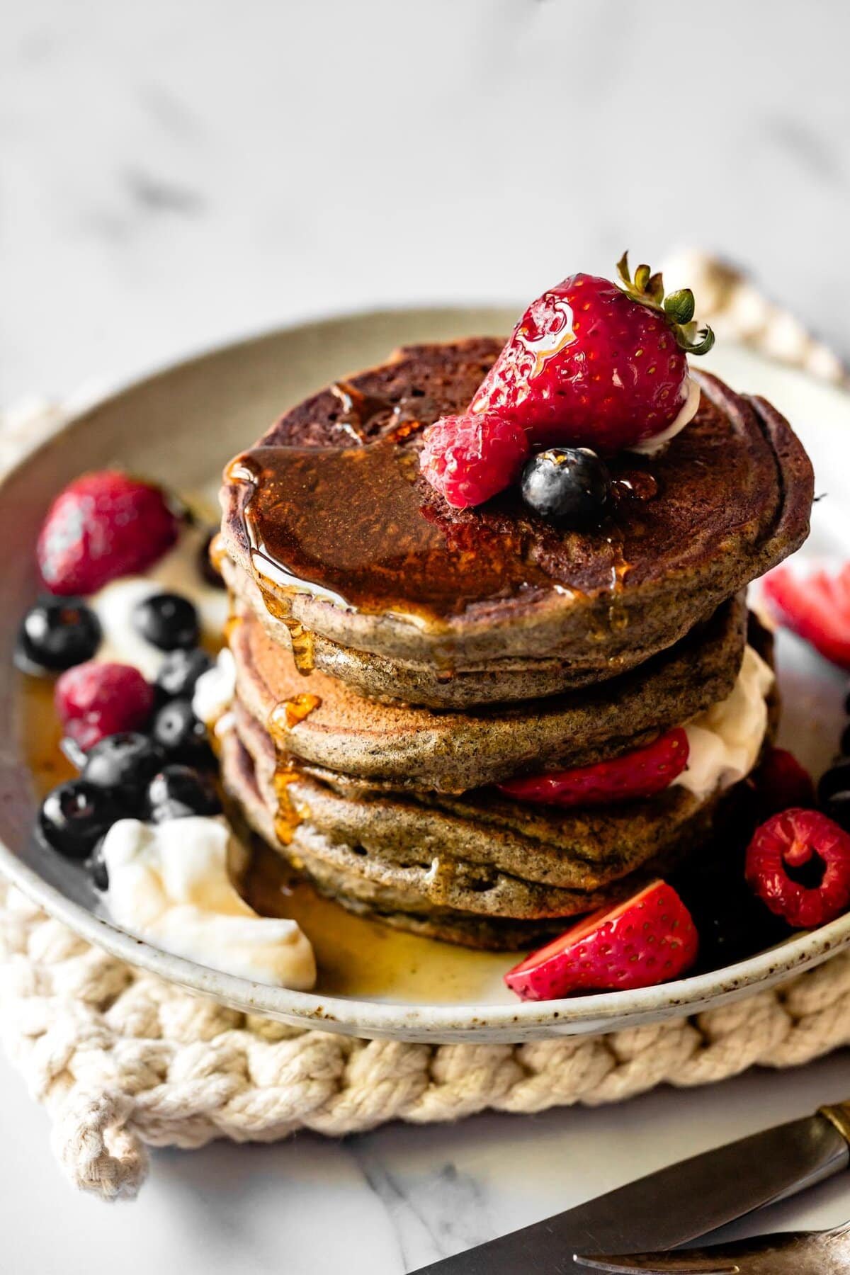 a stack of pancakes with toppings