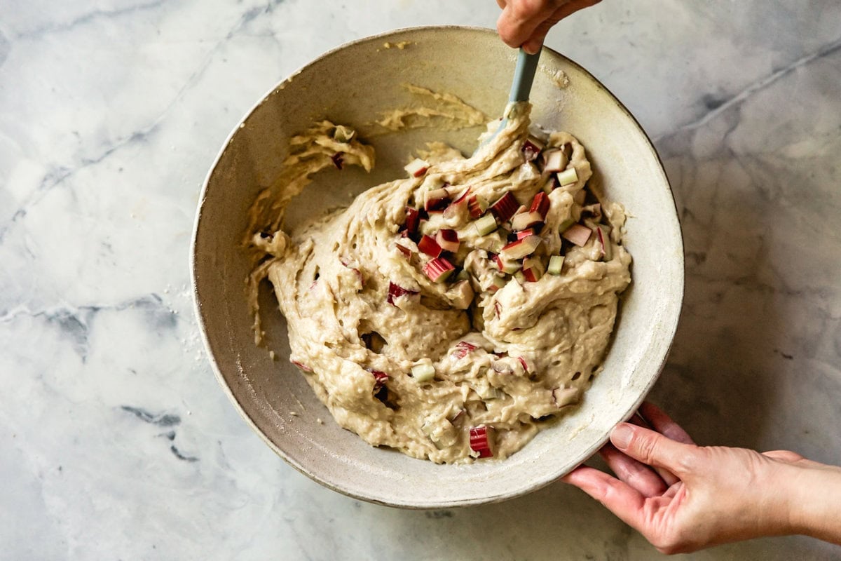 stirring the thick muffin batter