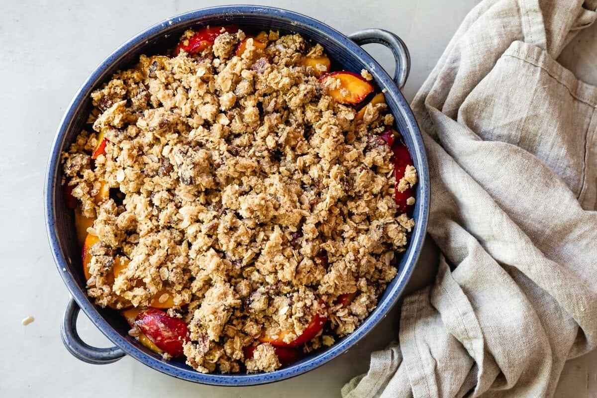 Sprinkled over the peaches and ready to bake